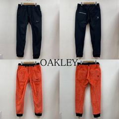 OAKLEY オークリー パンツ ワークパンツ、ペインターパンツ ゴルフ スラックス SKULL REVERSIBLE WIND PANTS 2.0 FOA402856