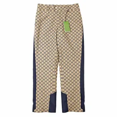 【未使用】GUCCI グッチ パンツ インナーパテッド 中綿 GG ロゴ モノグラム ジャガード サイドライン 切替 裾ジップ バイカラー ボトムス ハンガー付属 メンズ サイズ 48 イエロー ネイビー 黄色 紺 イタリア製 721764 ZAKYZのサムネイル