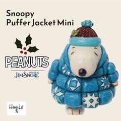 Snoopy Mini Puffy Jacket by Jim Shore. This Jim Shore Peanuts figure is a miniature figurine and sculpture. Authentic Jim Shore import. This Snoopy Mini puffer jacket is a stylish Christmas decoration.