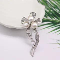 スワロフスキージルコンリボンブローチ淡水真珠コサージュ結婚式入学式卒業式記念日