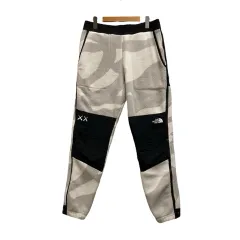 ザノースフェイス THE NORTH FACE KAWS 1995 Denali Pant パンツ 総柄 ロゴ刺繍 ウエストゴム NF0A7WMC8K41 M 黒 ブラック グレージュ アイボリー メンズ