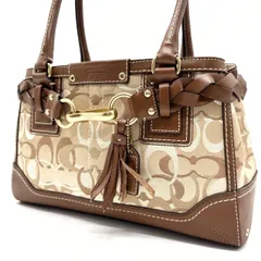 ✨美品✨ COACH コーチ トートバッグ ハンドバッグ  ハンプトンズ シグネチャー 総柄 編み込み タッセル ゴールド金具 ロゴ型押し 肩掛け キャンバス レザー レディース ベージュ 肌色 ブラウン 茶色