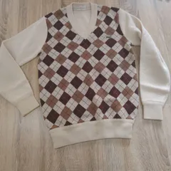 ラコステ。ニットセーター。無地部クリーム系。