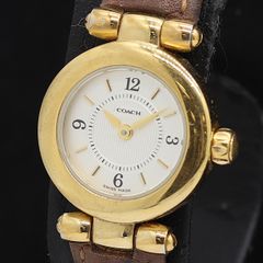 不動】COACH ゴールドカラー ラインストーンベゼル 腕時計 - メルカリ