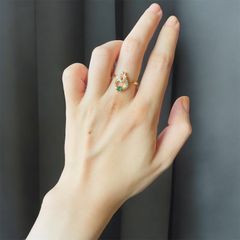 円の中に輝きとグリーン✨ジルコニアリング ゴールド 指輪 フリーサイズ