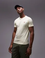 【送料無料】 リーバイス メンズ Tシャツ トップス Levi's Original batwing logo textured stripe t-shirt in yellow yellow