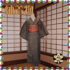 【小紋】茶色に更紗模様の紬着物