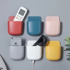 壁掛けリモコンラック ホワイト1個 粘着テープ式 充電口付き 多機能収納 スマホ ペン 小物用 ni10000a514のサムネイル