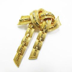 ヴィンテージ Jewelcraft ジュエルクラフト リボンモチーフ ブローチ ゴールドカラー アクセサリー レディース L215LF