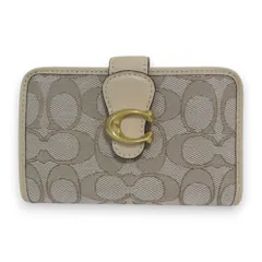 新品同様 COACH コーチ レザー シグネチャージャガード タビー 二つ折り財布 コンパクトウォレット CA194 ベージュ×ゴールド金具 レディース 古着 中古 USED