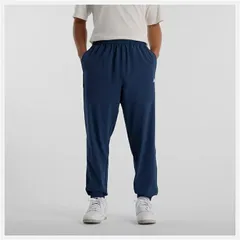 ニューバランス ウィンドブレーカーパンツ メンズ Newbalance ウーブントラックジョガーパンツ ロングパンツ 吸汗速乾 ドライ トレーニングパンツ ウインドブレーカー スポーツウェア  ネイビー 紺 長ズボン ずぼん 服  /AMP51205-NNY